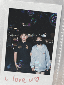 a polaroid of a boy and a girl holding hands with the words " i love u " written on it
