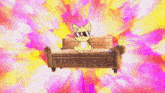 a cat is sitting on a couch in front of a pink and yellow background