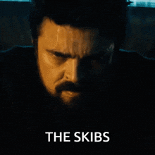 a close up of a man 's face with the words " the skibs " below it