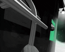 a green light is shining on a black background