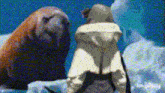 a seal and a polar bear are standing next to each other on ice