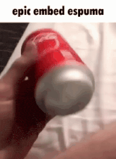 a person is holding a coca cola can with the words epic embed espuma above it