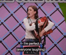 a woman holding an accordion says i 'm perfect