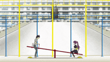 a man and a woman are playing on a seesaw in front of a building