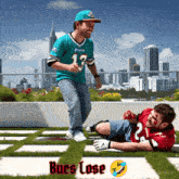 a man in a miami dolphins jersey is standing next to another man