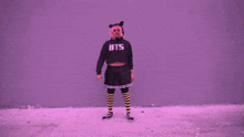 a girl with pink hair is wearing a black shirt that says ' i 'm a cat '