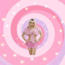 a woman in a pink dress is standing in a pink and purple swirl