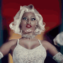 a woman with blonde hair and a choker with the word slut on it
