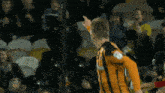a soccer player wearing a jersey that says ' bwin ' on the front
