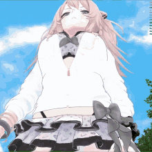 a computer screen shows a girl in a white top and a gray skirt