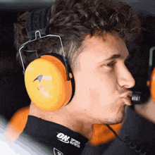 a man wearing headphones and making a funny face