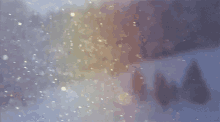 a snowy forest with trees in the background and snow falling