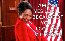 a woman in a red jacket is standing in front of an american flag and says amen yes lord because of you i got the victory