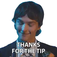 a man in a suit and tie is smiling and says thanks for the tip