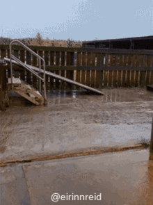 stairs leading up to a wooden fence with a caption that says @eirinnreid
