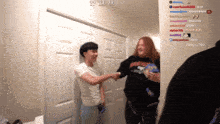 two people shaking hands in front of a door with the time 00 13 34 on the bottom
