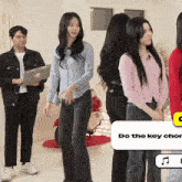 a group of people standing in front of a sign that says " do the key chord "