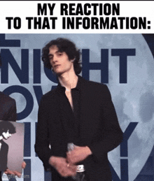 a man in a suit is standing in front of a sign that says ' my reaction to that information '