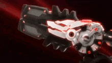 a close up of a robot with a red light coming out of it 's mouth .