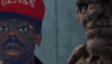 a man wearing a red hat that says glass