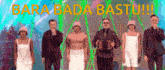 a group of people standing next to each other with the words bara bada bastu written in yellow