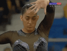 a female gymnast is on a sportv2 ao vivo broadcast