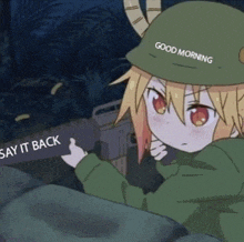 a girl in a military uniform is holding a gun and saying `` good morning '' .