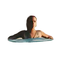 a woman is floating in a pool of water