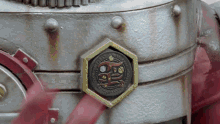 a close up of a metal item with chinese writing