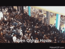 a crowd of people in a mall with the words when ohhzy hosts at the bottom