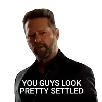 a man with a beard and a suit says " you guys look pretty settled "