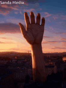 a sanda media advertisement with a hand reaching out over a city