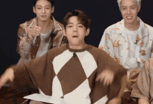 a man wearing a shirt that says ' abercrombie & fitch ' on it is dancing