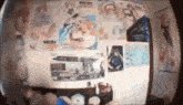 a room with a lot of posters on the wall including one that says ' i love you ' on it