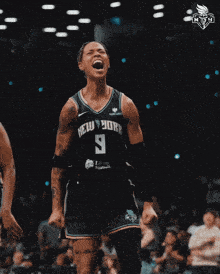 a female basketball player wearing a new york jersey celebrates