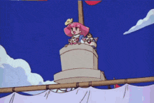 a girl with pink hair is sitting on top of a tower with two dogs
