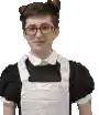 a young man in a maid costume and apron is wearing glasses .