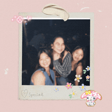 a polaroid picture of three girls with special written on the bottom right