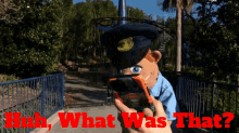 a puppet holding a cell phone with the words huh what was that