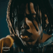 a close up of a person 's face with the word prime on the bottom left