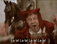 a man in a devil costume is singing la la la la la la la la