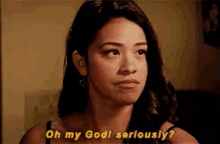 a woman is looking at the camera and saying `` oh my god seriously ? ''