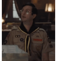 a man in a boy scout uniform has a badge on his chest that says ' u.s. army '