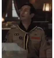 a man in a boy scout uniform has a badge on his chest that says ' u.s. army '