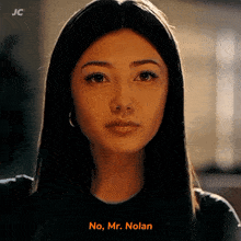 a close up of a woman 's face with the words " no mr. nolan " above her