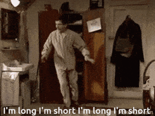 a man in pajamas is jumping in a room with the words i 'm long i 'm short i 'm long
