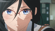 a close up of a girl wearing glasses looking at the camera