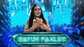 a female wrestler named tatum paxley holds a cupcake