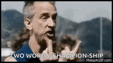 a man with a beard is giving the middle finger and saying `` two words : champion-ship '' .