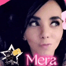 a close up of a woman 's face with the word mera in pink